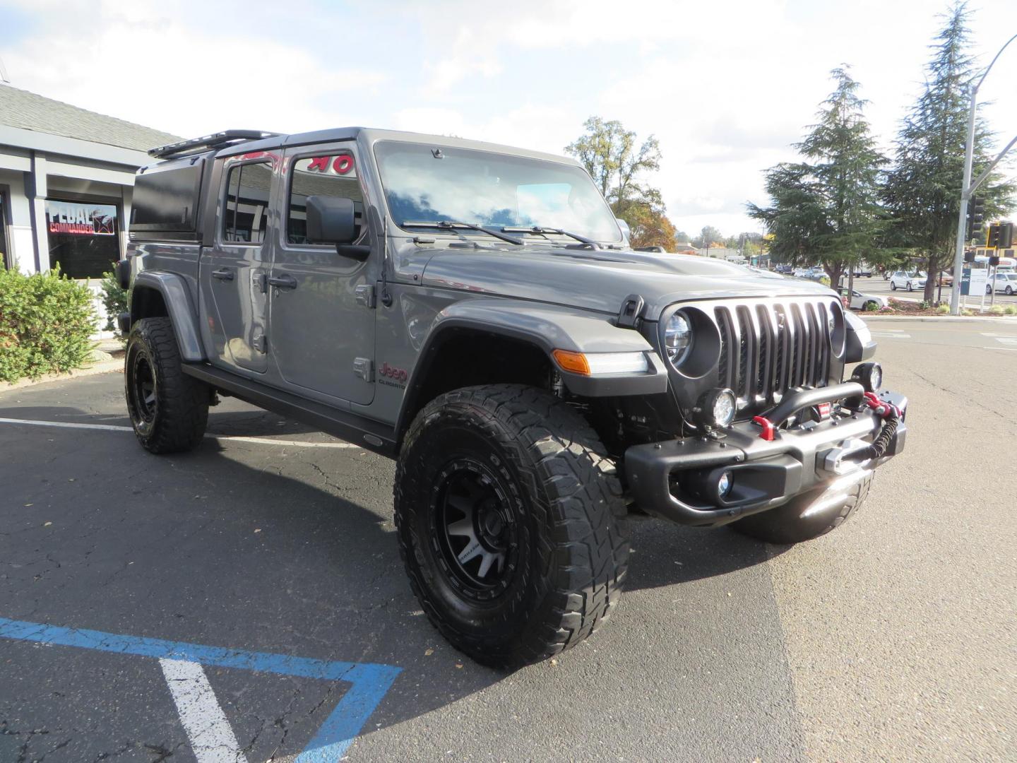 2020 CHARCOAL Jeep Gladiator Rubicon (1C6JJTBG9LL) with an 3.6L V6 DOHC 24V engine, 6M transmission, located at 2630 Grass Valley Highway, Auburn, CA, 95603, (530) 508-5100, 38.937893, -121.095482 - Clean Gladiator featuring a Mopar lift kit, Fox front shocks, Fox 2.5 DSC rear shocks, 37" Toyo RT tires, 17" Method wheels, Wan Winch, Mopar stinger bar, Vision X front leds, Rockslide Engineering power steps, RLD Camper shell, RLD Platform Roof Rack, RLD Kitchen Cabinet, RLD drop down table, Led b - Photo#1