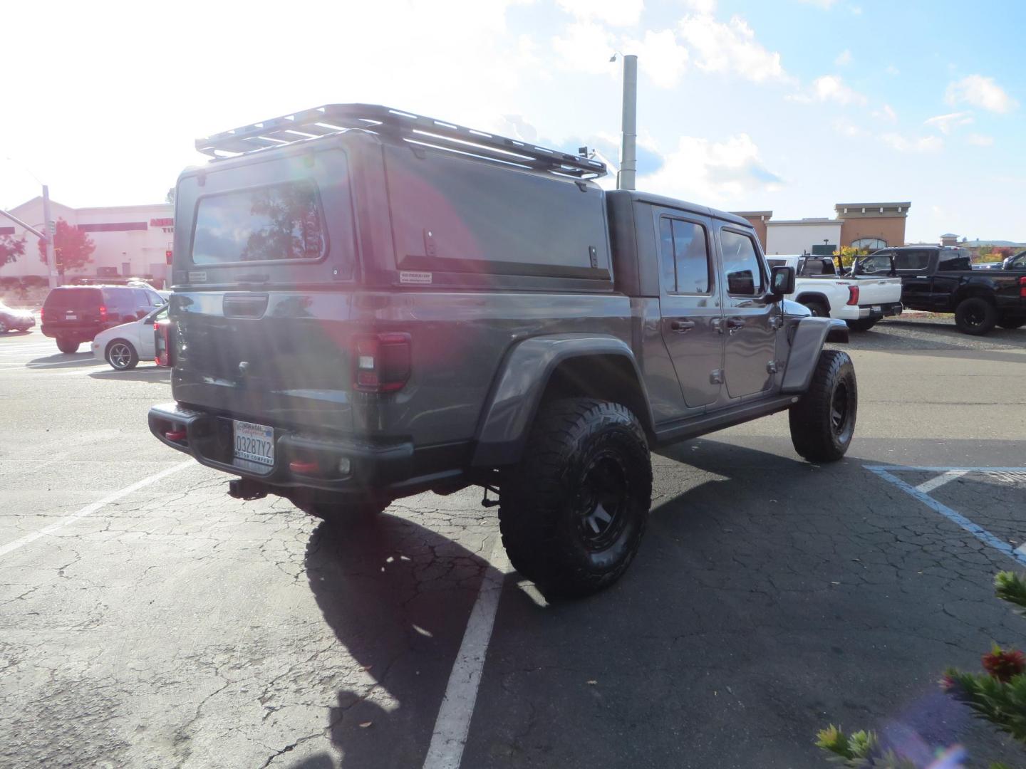 2020 CHARCOAL Jeep Gladiator Rubicon (1C6JJTBG9LL) with an 3.6L V6 DOHC 24V engine, 6M transmission, located at 2630 Grass Valley Highway, Auburn, CA, 95603, (530) 508-5100, 38.937893, -121.095482 - Clean Gladiator featuring a Mopar lift kit, Fox front shocks, Fox 2.5 DSC rear shocks, 37" Toyo RT tires, 17" Method wheels, Wan Winch, Mopar stinger bar, Vision X front leds, Rockslide Engineering power steps, RLD Camper shell, RLD Platform Roof Rack, RLD Kitchen Cabinet, RLD drop down table, Led b - Photo#3