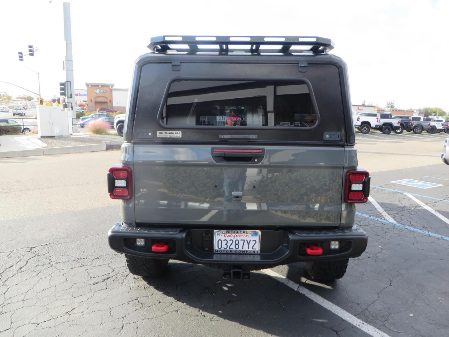 2020 CHARCOAL Jeep Gladiator Rubicon (1C6JJTBG9LL) with an 3.6L V6 DOHC 24V engine, 6M transmission, located at 2630 Grass Valley Highway, Auburn, CA, 95603, (530) 508-5100, 38.937893, -121.095482 - Clean Gladiator featuring a Mopar lift kit, Fox front shocks, Fox 2.5 DSC rear shocks, 37" Toyo RT tires, 17" Method wheels, Wan Winch, Mopar stinger bar, Vision X front leds, Rockslide Engineering power steps, RLD Camper shell, RLD Platform Roof Rack, RLD Kitchen Cabinet, RLD drop down table, Led b - Photo#6