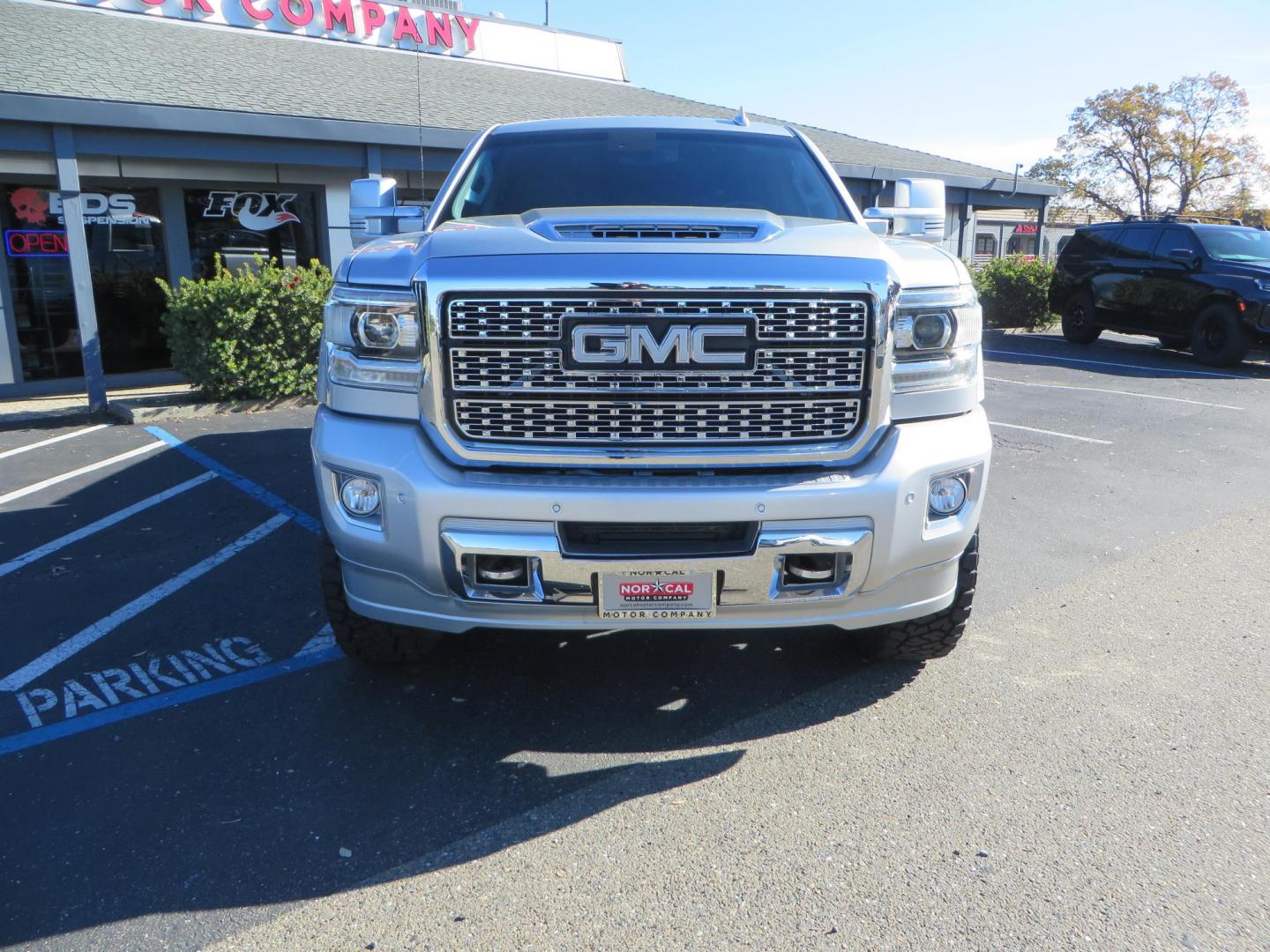 2018 SILVER GMC Sierra 2500HD Denali Crew Cab 4WD (1GT12UEY3JF) with an 6.6L V8 OHV 16 DIESEL engine, 6A transmission, located at 2630 Grass Valley Highway, Auburn, CA, 95603, (530) 508-5100, 38.937893, -121.095482 - Dont miss this Duramax.... Featuring a FTS leveling kit, Front Fox 2.0 remote reservoir shocks, Toyo RT Trail tires, Paint match all over, and Window tint. - Photo#1