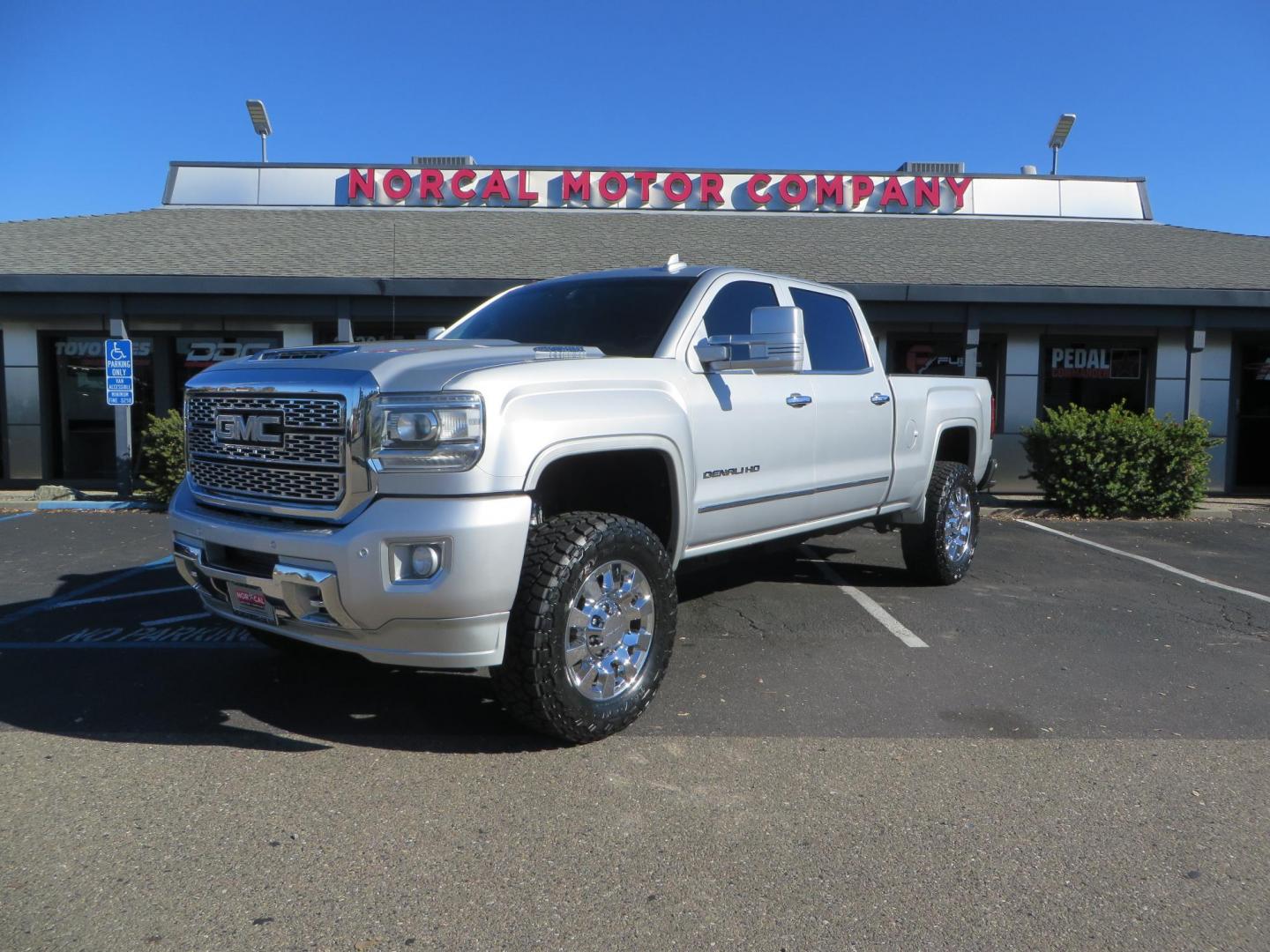 2018 SILVER GMC Sierra 2500HD Denali Crew Cab 4WD (1GT12UEY3JF) with an 6.6L V8 OHV 16 DIESEL engine, 6A transmission, located at 2630 Grass Valley Highway, Auburn, CA, 95603, (530) 508-5100, 38.937893, -121.095482 - Dont miss this Duramax.... Featuring a FTS leveling kit, Front Fox 2.0 remote reservoir shocks, Toyo RT Trail tires, Paint match all over, and Window tint. - Photo#0