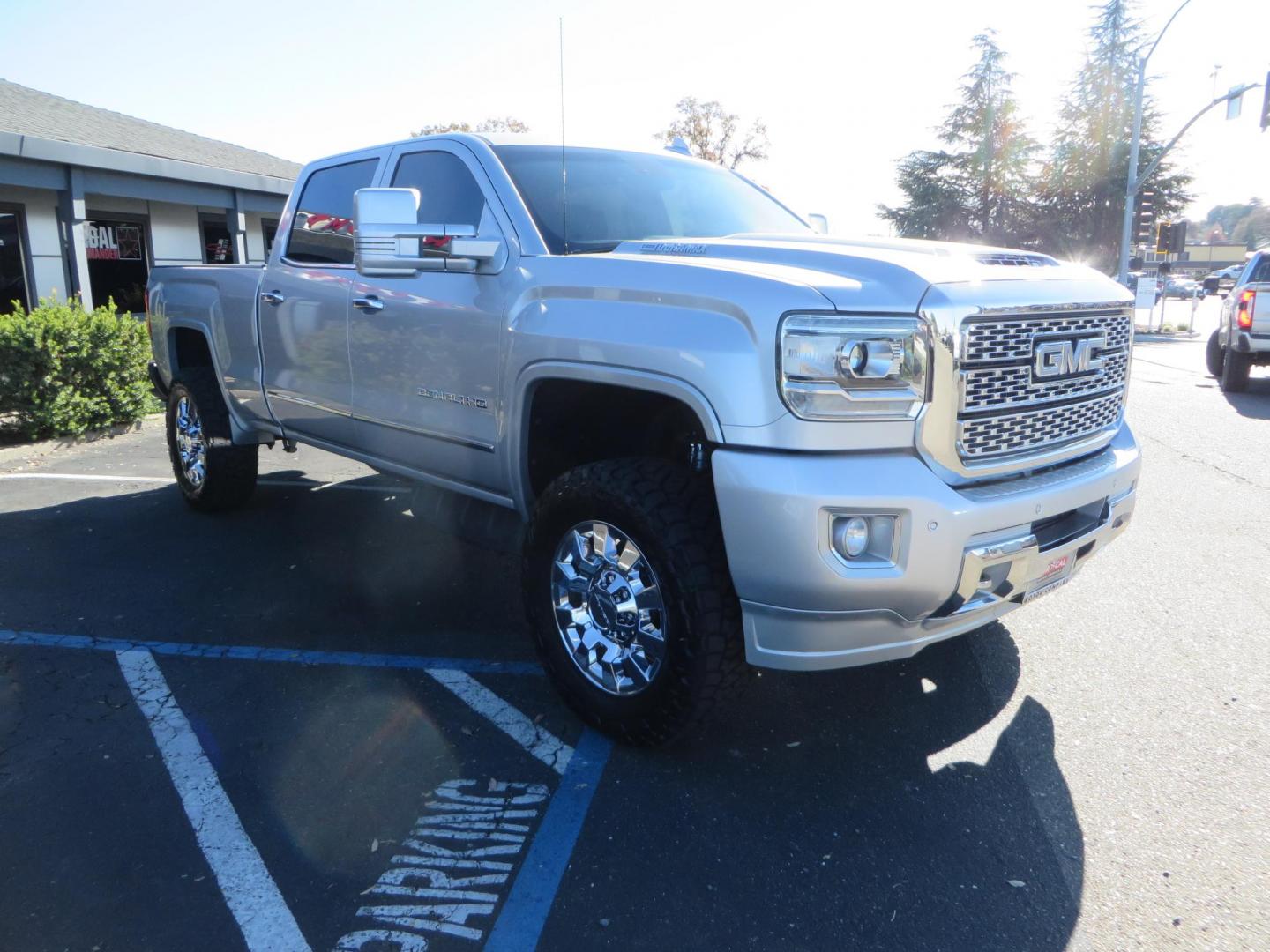 2018 SILVER GMC Sierra 2500HD Denali Crew Cab 4WD (1GT12UEY3JF) with an 6.6L V8 OHV 16 DIESEL engine, 6A transmission, located at 2630 Grass Valley Highway, Auburn, CA, 95603, (530) 508-5100, 38.937893, -121.095482 - Dont miss this Duramax.... Featuring a FTS leveling kit, Front Fox 2.0 remote reservoir shocks, Toyo RT Trail tires, Paint match all over, and Window tint. - Photo#2