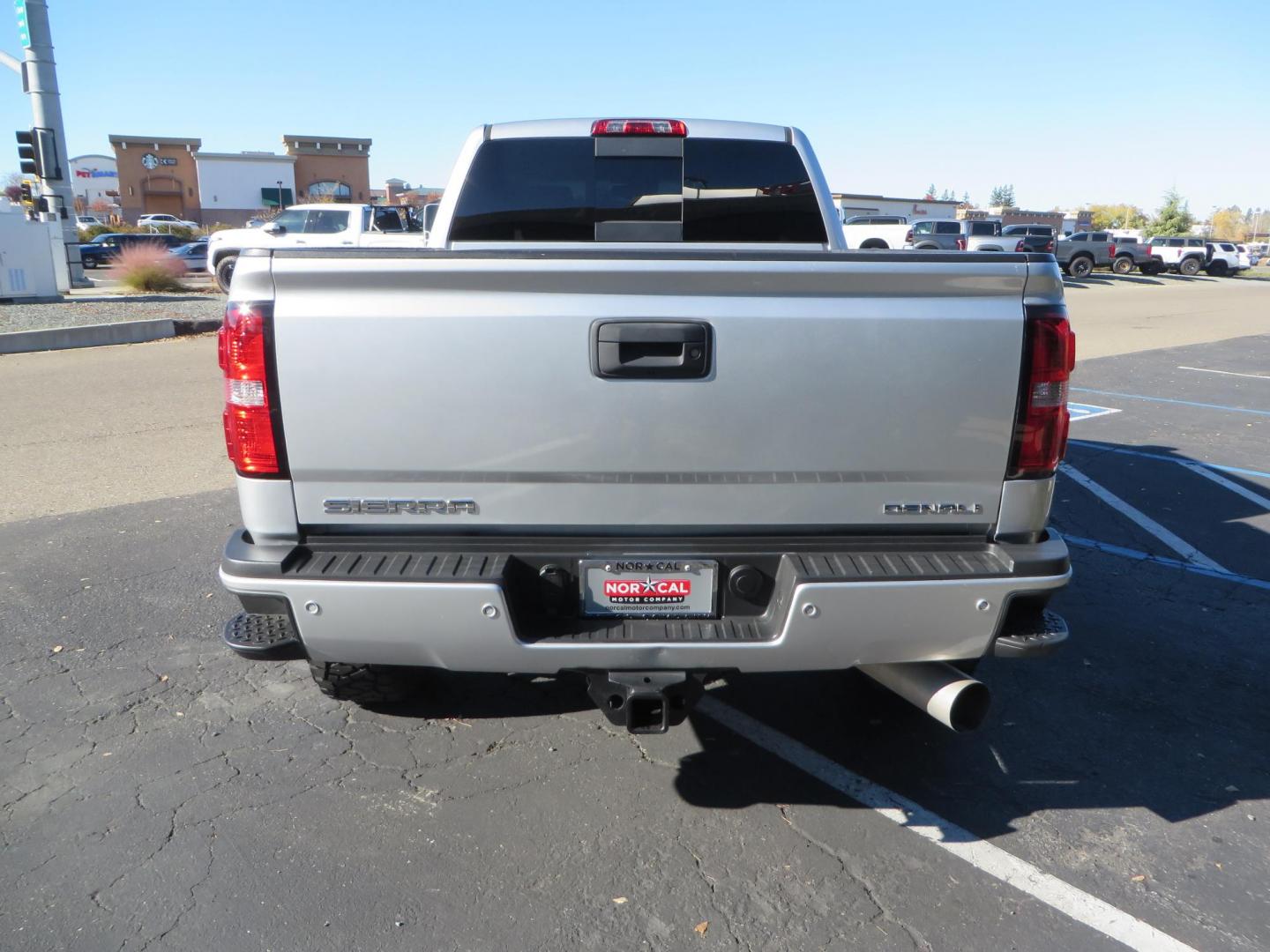 2018 SILVER GMC Sierra 2500HD Denali Crew Cab 4WD (1GT12UEY3JF) with an 6.6L V8 OHV 16 DIESEL engine, 6A transmission, located at 2630 Grass Valley Highway, Auburn, CA, 95603, (530) 508-5100, 38.937893, -121.095482 - Dont miss this Duramax.... Featuring a FTS leveling kit, Front Fox 2.0 remote reservoir shocks, Toyo RT Trail tires, Paint match all over, and Window tint. - Photo#3