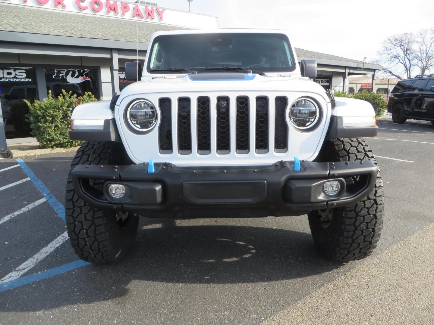 2021 White Jeep Wrangler Unlimited Rubicon 4XE (1C4JJXR62MW) with an 2.0L L4 DOHC 16V HYBRID engine, 8A transmission, located at 2630 Grass Valley Highway, Auburn, CA, 95603, (530) 508-5100, 38.937893, -121.095482 - 4xe Rubicon featuring a JKS suspension system, Fox adventure series shocks, 17" Method NV double black wheels, 37" Falken Wildpeak RT tires, Amp Power steps, Teraflex HD tire carrier, and window tint. - Photo#1