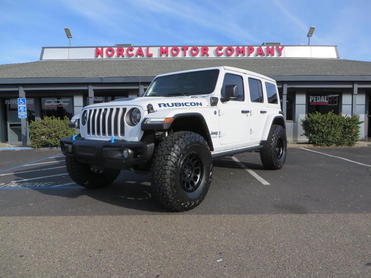 2021 White Jeep Wrangler Unlimited Rubicon 4XE (1C4JJXR62MW) with an 2.0L L4 DOHC 16V HYBRID engine, 8A transmission, located at 2630 Grass Valley Highway, Auburn, CA, 95603, (530) 508-5100, 38.937893, -121.095482 - 4xe Rubicon featuring a JKS suspension system, Fox adventure series shocks, 17" Method NV double black wheels, 37" Falken Wildpeak RT tires, Amp Power steps, Teraflex HD tire carrier, and window tint. - Photo#0