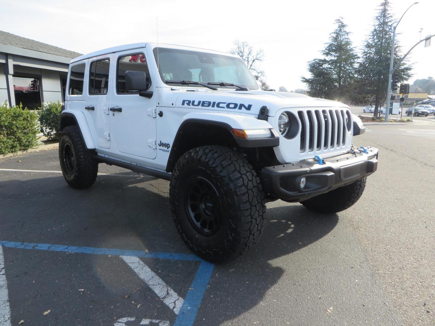 2021 White Jeep Wrangler Unlimited Rubicon 4XE (1C4JJXR62MW) with an 2.0L L4 DOHC 16V HYBRID engine, 8A transmission, located at 2630 Grass Valley Highway, Auburn, CA, 95603, (530) 508-5100, 38.937893, -121.095482 - 4xe Rubicon featuring a JKS suspension system, Fox adventure series shocks, 17" Method NV double black wheels, 37" Falken Wildpeak RT tires, Amp Power steps, Teraflex HD tire carrier, and window tint. - Photo#2