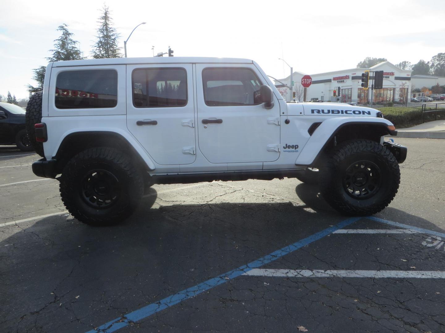 2021 White Jeep Wrangler Unlimited Rubicon 4XE (1C4JJXR62MW) with an 2.0L L4 DOHC 16V HYBRID engine, 8A transmission, located at 2630 Grass Valley Highway, Auburn, CA, 95603, (530) 508-5100, 38.937893, -121.095482 - 4xe Rubicon featuring a JKS suspension system, Fox adventure series shocks, 17" Method NV double black wheels, 37" Falken Wildpeak RT tires, Amp Power steps, Teraflex HD tire carrier, and window tint. - Photo#3