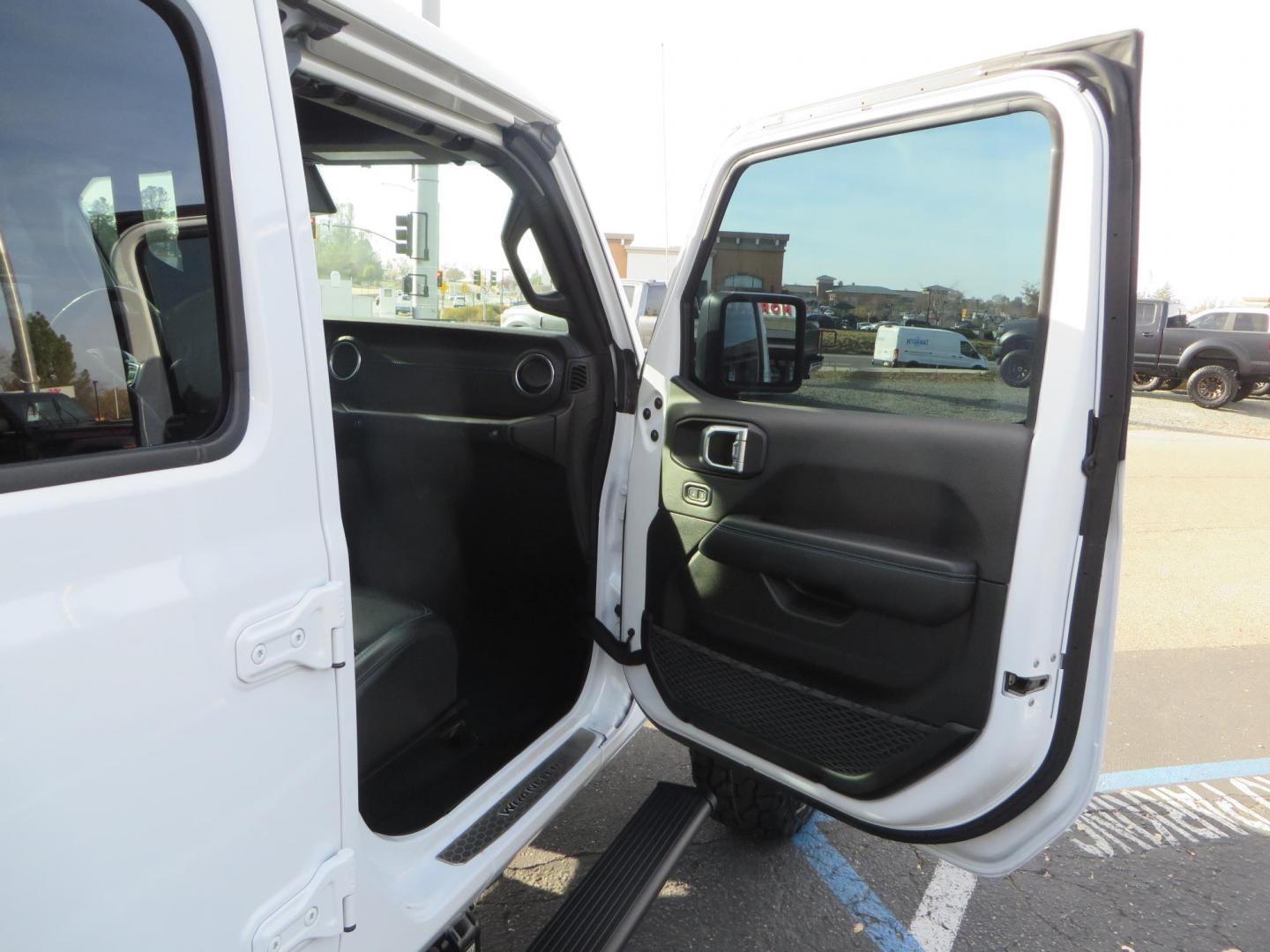 2021 White Jeep Wrangler Unlimited Rubicon 4XE (1C4JJXR62MW) with an 2.0L L4 DOHC 16V HYBRID engine, 8A transmission, located at 2630 Grass Valley Highway, Auburn, CA, 95603, (530) 508-5100, 38.937893, -121.095482 - 4xe Rubicon featuring a JKS suspension system, Fox adventure series shocks, 17" Method NV double black wheels, 37" Falken Wildpeak RT tires, Amp Power steps, Teraflex HD tire carrier, and window tint. - Photo#52