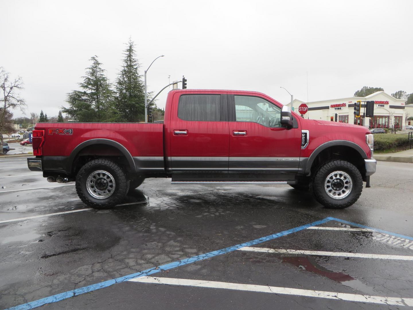 2020 Maroon /black Ford F-250 SD Lariat Crew Cab 4WD (1FT8W2BT1LE) with an 6.7L V8 OHV 16V DIESEL engine, 6A transmission, located at 2630 Grass Valley Highway, Auburn, CA, 95603, (530) 508-5100, 38.937893, -121.095482 - Features - 18" Method MR315 wheels, and 35" Nitto Ridge Grappler tires. - Photo#4