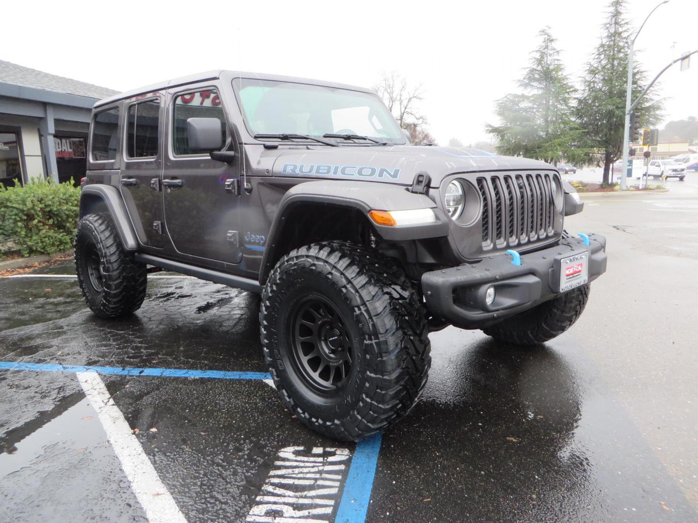 2021 CHARCOAL /BLACK Jeep Wrangler Unlimited Rubicon 4XE (1C4JJXR68MW) with an 2.0L L4 DOHC 16V HYBRID engine, 8A transmission, located at 2630 Grass Valley Highway, Auburn, CA, 95603, (530) 508-5100, 38.937893, -121.095482 - 4xe Rubicon sitting on a JKS suspension system, Fox shocks, 17" Method MR703 beadgrip wheels, 37" Toyo MT tires, and a Teraflex HD spare tire carrier. - Photo#1