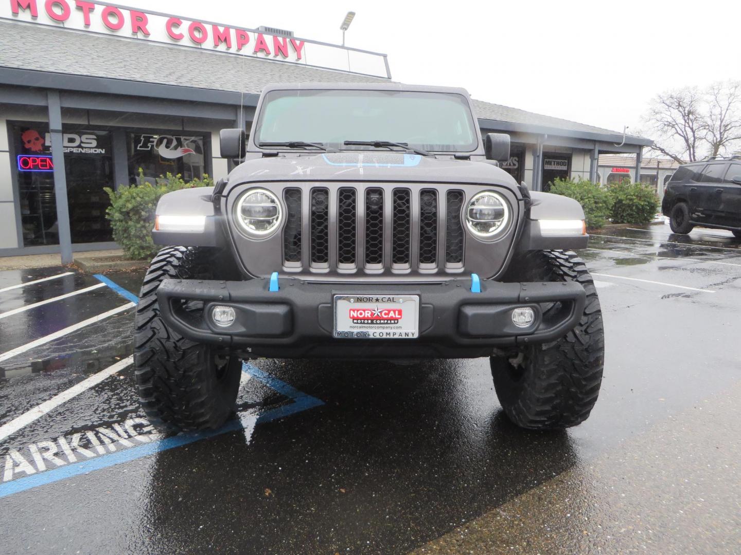 2021 CHARCOAL /BLACK Jeep Wrangler Unlimited Rubicon 4XE (1C4JJXR68MW) with an 2.0L L4 DOHC 16V HYBRID engine, 8A transmission, located at 2630 Grass Valley Highway, Auburn, CA, 95603, (530) 508-5100, 38.937893, -121.095482 - 4xe Rubicon sitting on a JKS suspension system, Fox shocks, 17" Method MR703 beadgrip wheels, 37" Toyo MT tires, and a Teraflex HD spare tire carrier. - Photo#2