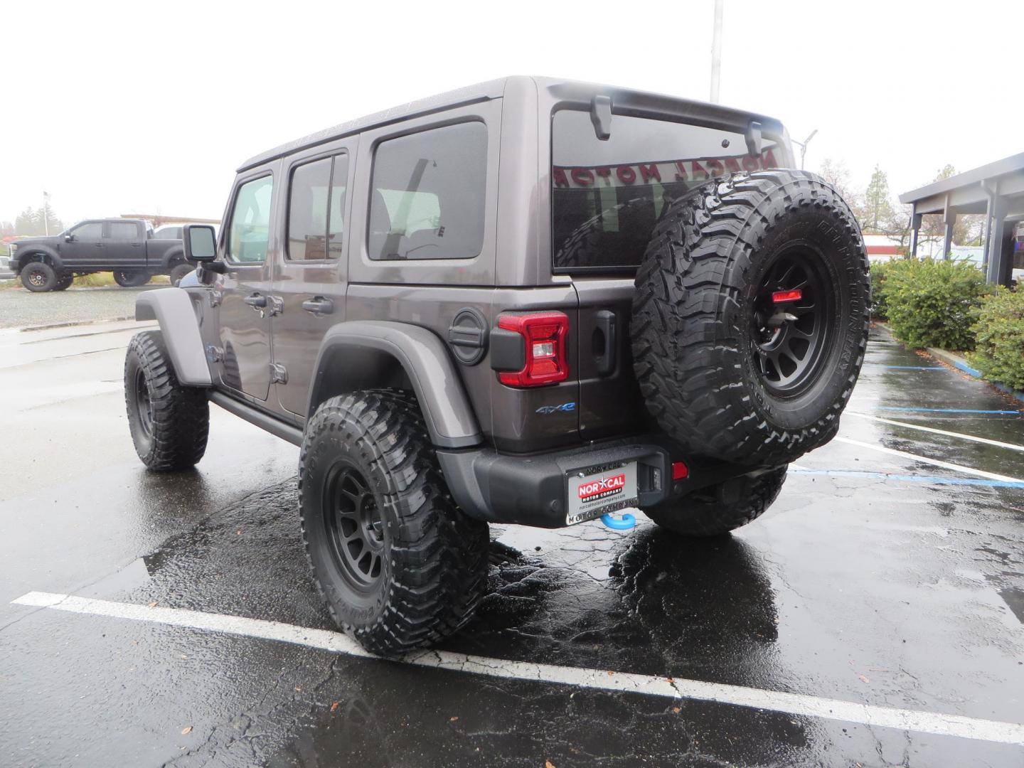 2021 CHARCOAL /BLACK Jeep Wrangler Unlimited Rubicon 4XE (1C4JJXR68MW) with an 2.0L L4 DOHC 16V HYBRID engine, 8A transmission, located at 2630 Grass Valley Highway, Auburn, CA, 95603, (530) 508-5100, 38.937893, -121.095482 - 4xe Rubicon sitting on a JKS suspension system, Fox shocks, 17" Method MR703 beadgrip wheels, 37" Toyo MT tires, and a Teraflex HD spare tire carrier. - Photo#6