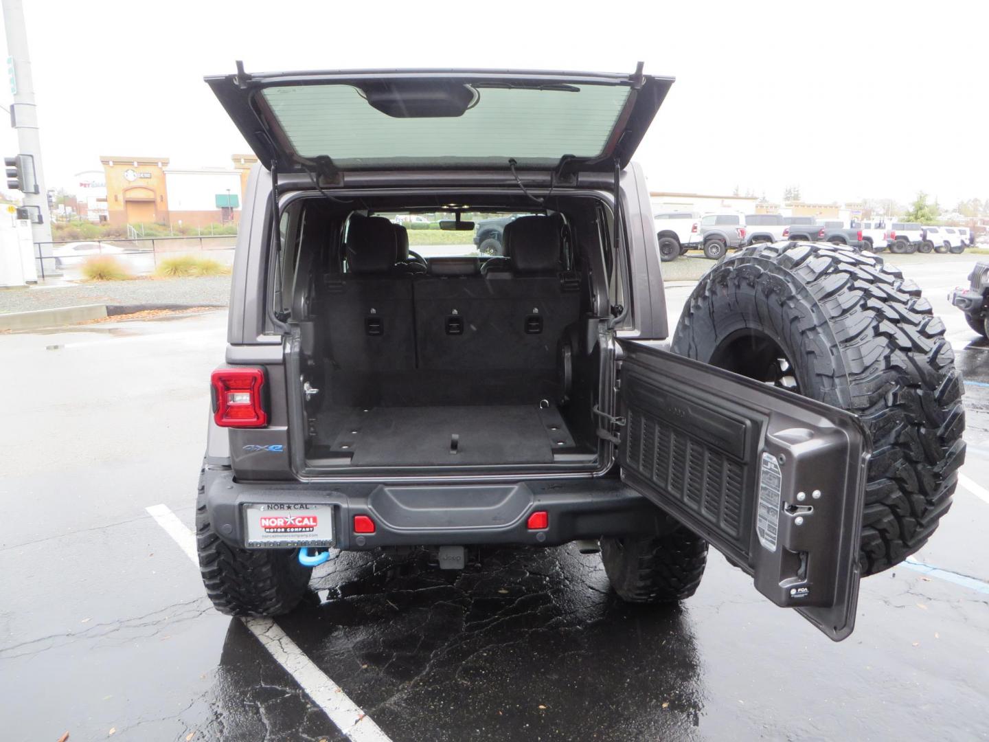 2021 CHARCOAL /BLACK Jeep Wrangler Unlimited Rubicon 4XE (1C4JJXR68MW) with an 2.0L L4 DOHC 16V HYBRID engine, 8A transmission, located at 2630 Grass Valley Highway, Auburn, CA, 95603, (530) 508-5100, 38.937893, -121.095482 - 4xe Rubicon sitting on a JKS suspension system, Fox shocks, 17" Method MR703 beadgrip wheels, 37" Toyo MT tires, and a Teraflex HD spare tire carrier. - Photo#65