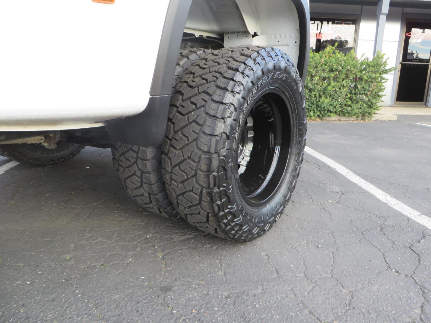 2022 White /Black Chevrolet Silverado 3500HD High Country Crew Cab 4WD (1GC4YVEY0NF) with an 6.6L V8 OHV 32V TURBO DIESEL engine, 6A transmission, located at 2630 Grass Valley Highway, Auburn, CA, 95603, (530) 508-5100, 38.937893, -121.095482 - Must see High Country Dually featuring a CST lift kit, 20" DDC wheels, Toyo Open Country RT Trail tires, Road Armor front and rear bumpers, Road Armor 12k Winch, Westin LED lights, and Window tint. - Photo#11