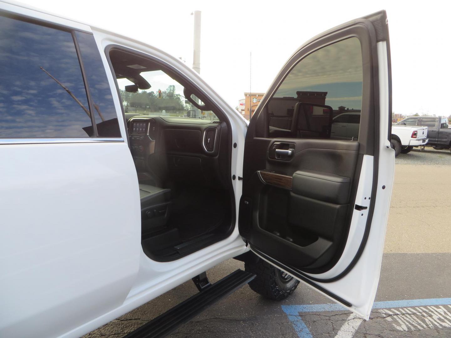 2022 White /Black Chevrolet Silverado 3500HD High Country Crew Cab 4WD (1GC4YVEY0NF) with an 6.6L V8 OHV 32V TURBO DIESEL engine, 6A transmission, located at 2630 Grass Valley Highway, Auburn, CA, 95603, (530) 508-5100, 38.937893, -121.095482 - Must see High Country Dually featuring a CST lift kit, 20" DDC wheels, Toyo Open Country RT Trail tires, Road Armor front and rear bumpers, Road Armor 12k Winch, Westin LED lights, and Window tint. - Photo#62