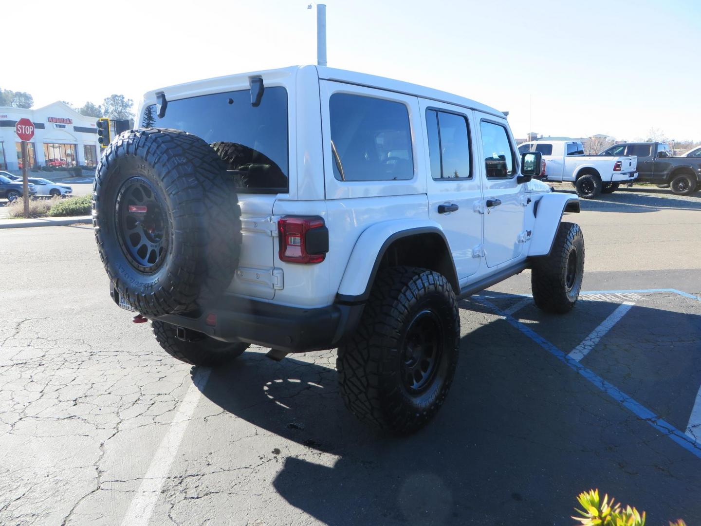 2020 White /Black Jeep Wrangler Unlimited Rubicon (1C4HJXFN2LW) with an 2.0L L4 DOHC 16V TURBO engine, 6A transmission, located at 2630 Grass Valley Highway, Auburn, CA, 95603, (530) 508-5100, 38.937893, -121.095482 - Featuring a Zone offroad suspension system, Fox shocks, 17" Method NV wheels, 37" Nitto Ridge Grappler tires, and a Teraflex HD tire carrier. - Photo#4