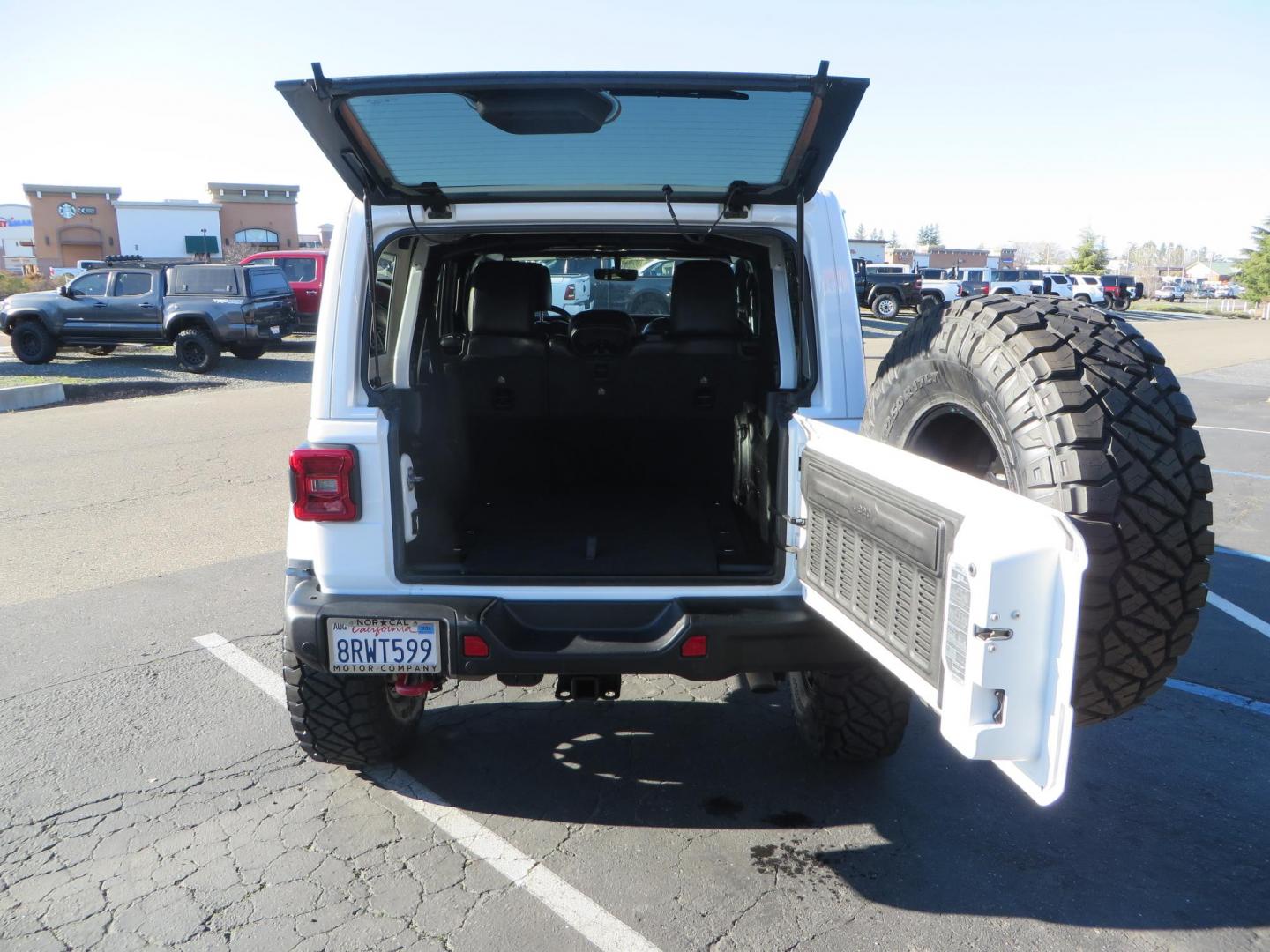 2020 White /Black Jeep Wrangler Unlimited Rubicon (1C4HJXFN2LW) with an 2.0L L4 DOHC 16V TURBO engine, 6A transmission, located at 2630 Grass Valley Highway, Auburn, CA, 95603, (530) 508-5100, 38.937893, -121.095482 - Featuring a Zone offroad suspension system, Fox shocks, 17" Method NV wheels, 37" Nitto Ridge Grappler tires, and a Teraflex HD tire carrier. - Photo#63