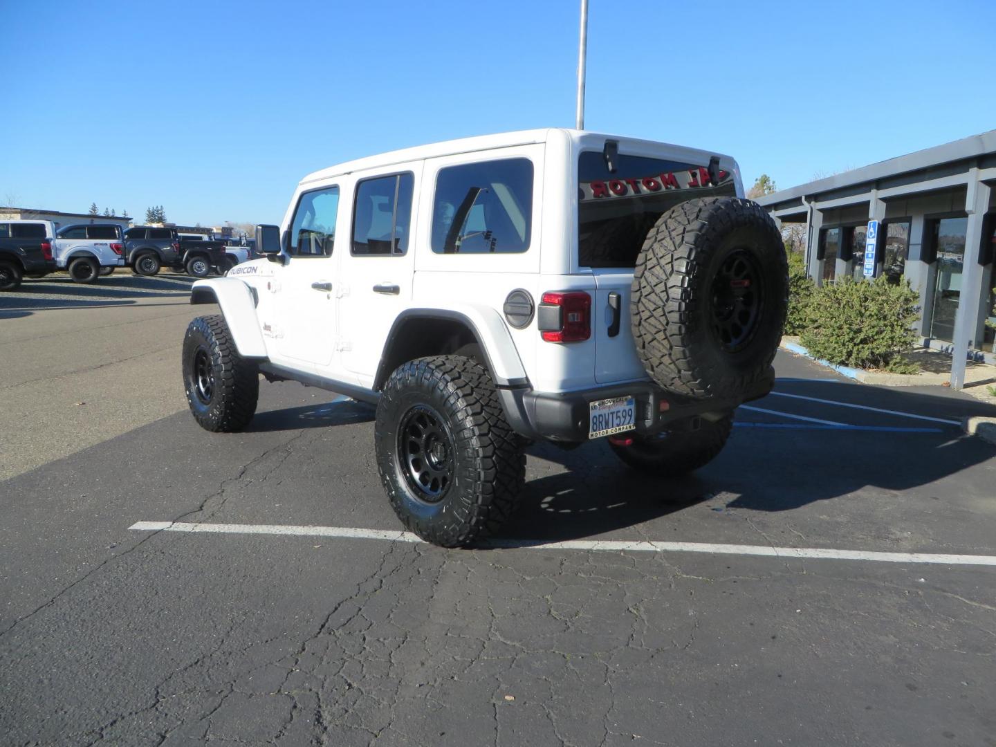 2020 White /Black Jeep Wrangler Unlimited Rubicon (1C4HJXFN2LW) with an 2.0L L4 DOHC 16V TURBO engine, 6A transmission, located at 2630 Grass Valley Highway, Auburn, CA, 95603, (530) 508-5100, 38.937893, -121.095482 - Featuring a Zone offroad suspension system, Fox shocks, 17" Method NV wheels, 37" Nitto Ridge Grappler tires, and a Teraflex HD tire carrier. - Photo#7