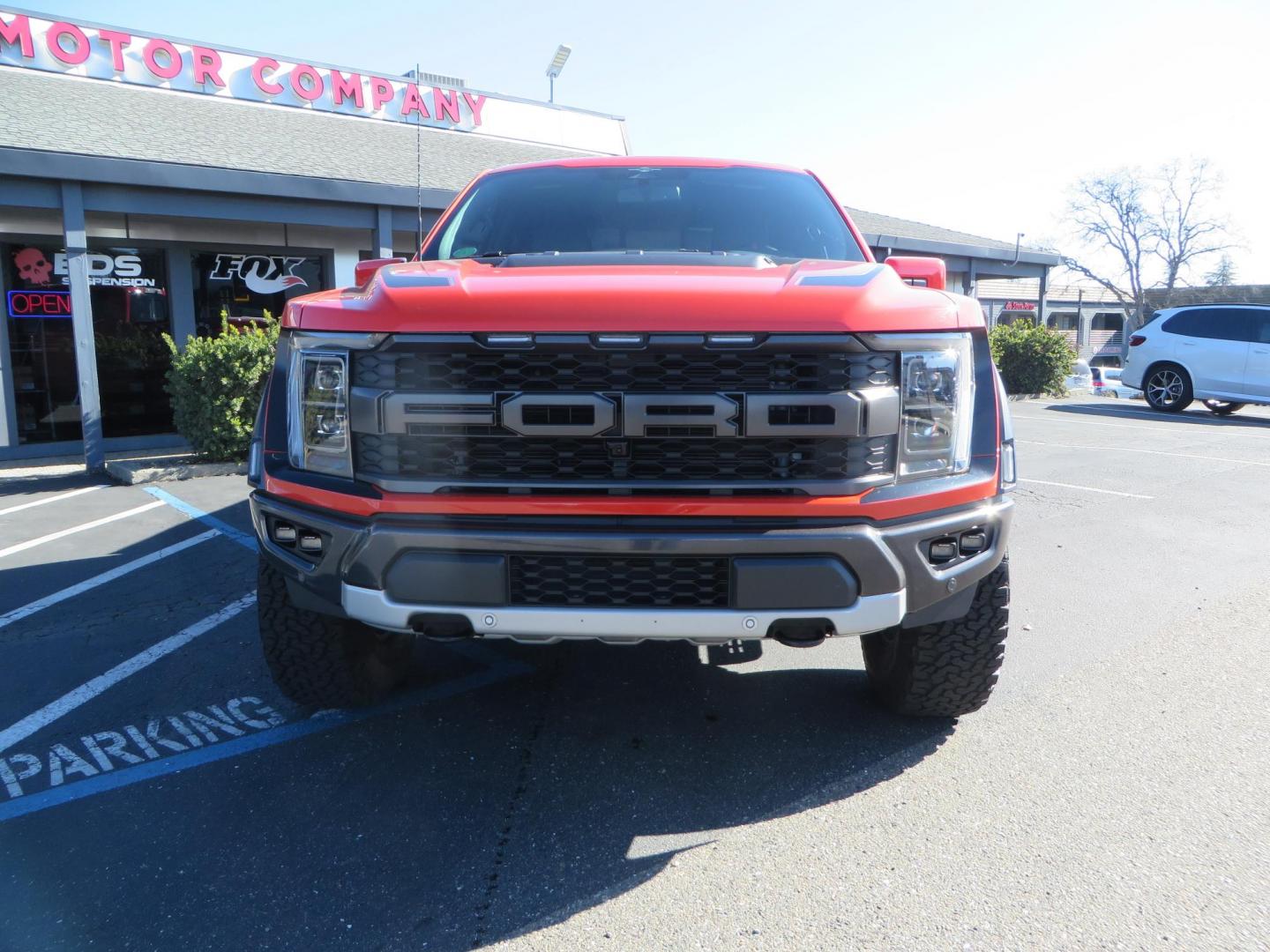 2023 Orange /Blue Ford F-150 Raptor 37 SuperCrew 4WD (1FTFW1RG4PF) with an 3.5 V6 engine, 6A transmission, located at 2630 Grass Valley Highway, Auburn, CA, 95603, (530) 508-5100, 38.937893, -121.095482 - Clean one owner Raptor 37 with Recaro Blue Accent seats, Pro Power Onboard 2K Generator, Power Tailgate, and Twin Panel Moonroof. - Photo#1