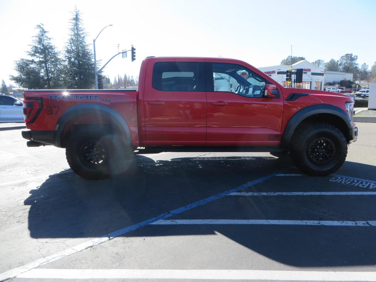 2023 Orange /Blue Ford F-150 Raptor 37 SuperCrew 4WD (1FTFW1RG4PF) with an 3.5 V6 engine, 6A transmission, located at 2630 Grass Valley Highway, Auburn, CA, 95603, (530) 508-5100, 38.937893, -121.095482 - Clean one owner Raptor 37 with Recaro Blue Accent seats, Pro Power Onboard 2K Generator, Power Tailgate, and Twin Panel Moonroof. - Photo#3