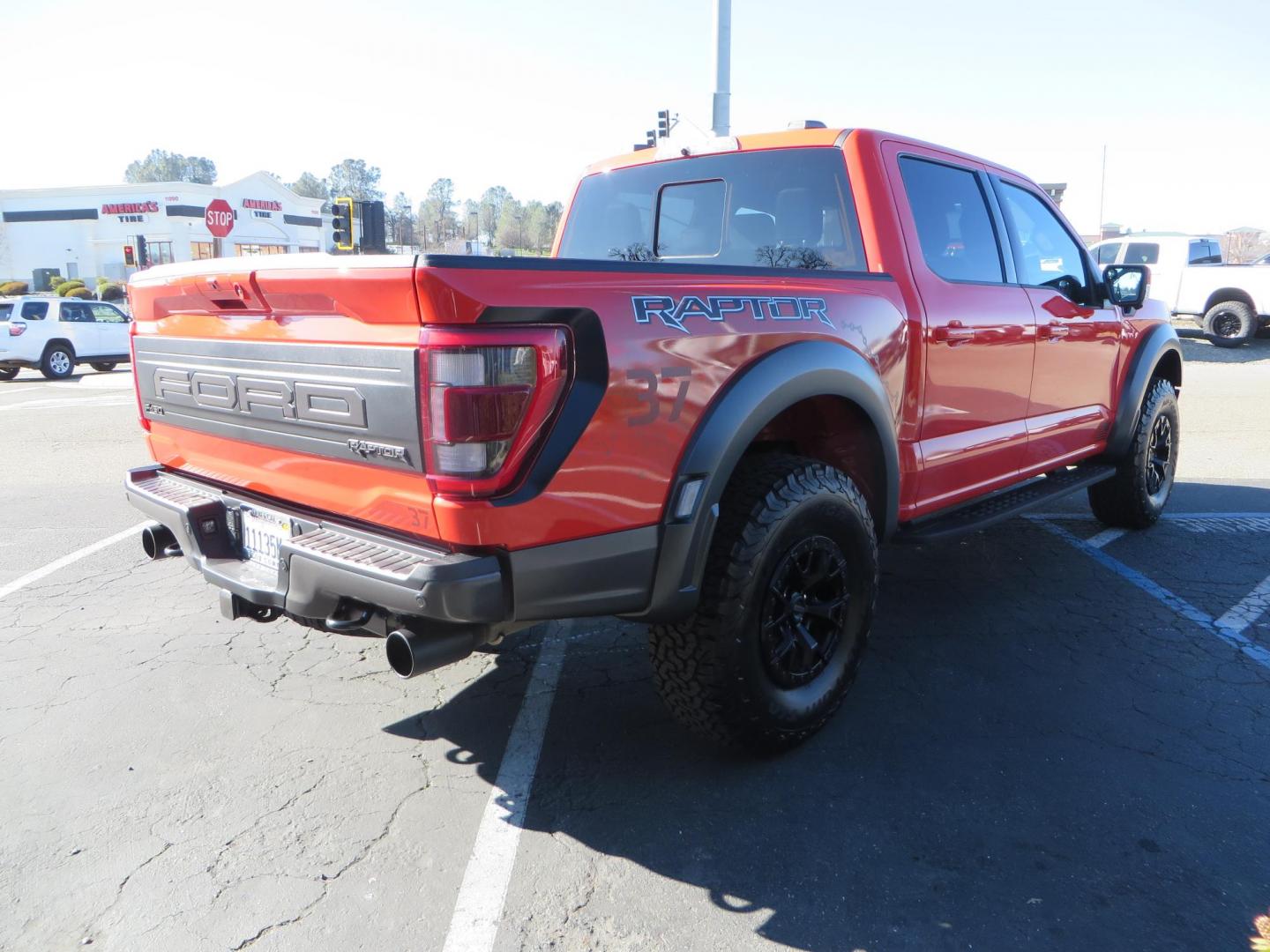 2023 Orange /Blue Ford F-150 Raptor 37 SuperCrew 4WD (1FTFW1RG4PF) with an 3.5 V6 engine, 6A transmission, located at 2630 Grass Valley Highway, Auburn, CA, 95603, (530) 508-5100, 38.937893, -121.095482 - Clean one owner Raptor 37 with Recaro Blue Accent seats, Pro Power Onboard 2K Generator, Power Tailgate, and Twin Panel Moonroof. - Photo#4