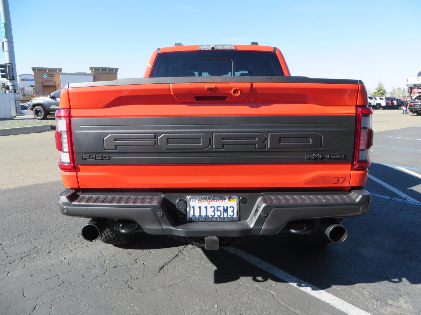 2023 Orange /Blue Ford F-150 Raptor 37 SuperCrew 4WD (1FTFW1RG4PF) with an 3.5 V6 engine, 6A transmission, located at 2630 Grass Valley Highway, Auburn, CA, 95603, (530) 508-5100, 38.937893, -121.095482 - Clean one owner Raptor 37 with Recaro Blue Accent seats, Pro Power Onboard 2K Generator, Power Tailgate, and Twin Panel Moonroof. - Photo#5