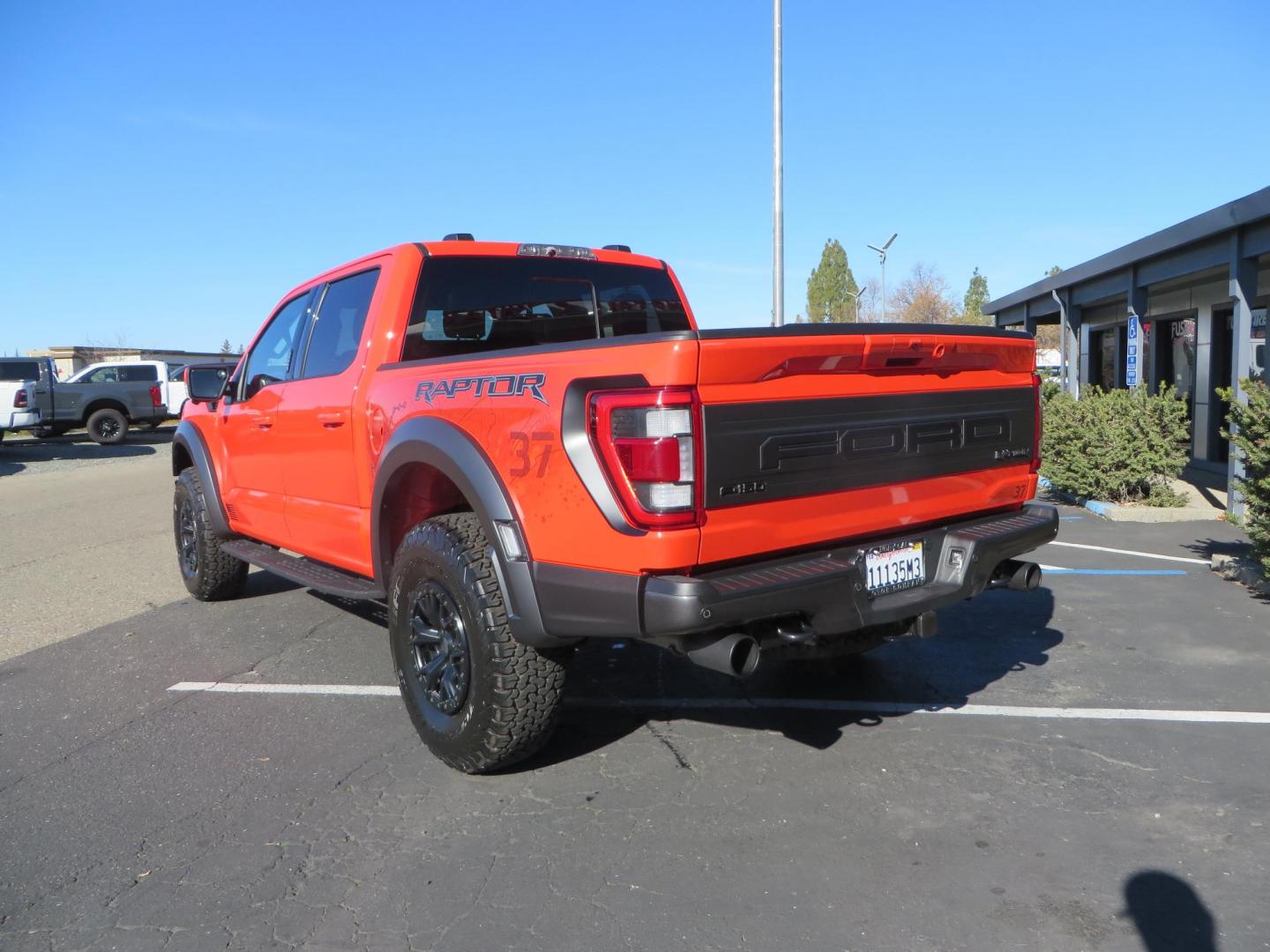 2023 Orange /Blue Ford F-150 Raptor 37 SuperCrew 4WD (1FTFW1RG4PF) with an 3.5 V6 engine, 6A transmission, located at 2630 Grass Valley Highway, Auburn, CA, 95603, (530) 508-5100, 38.937893, -121.095482 - Clean one owner Raptor 37 with Recaro Blue Accent seats, Pro Power Onboard 2K Generator, Power Tailgate, and Twin Panel Moonroof. - Photo#7