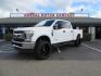 2019 White Ford F-250 SD XLT Crew Cab Short Bed 4WD (1FT7W2BT9KE) with an 6.7L V8 OHV 16V DIESEL engine, 6A transmission, located at 2630 Grass Valley Highway, Auburn, CA, 95603, (530) 508-5100, 38.937893, -121.095482 - Leveled XLT sitting on 22" SOTA Novakane wheels, 325 Nitto Ridge Grappler tires, Fox Shocks and dual steering stabilizers, Firestone Ride Rite air bags, Airlift wireless 1 air compressor, B&W Turnover gooseneck hitch, Weathertech floor liners, Deezee tailgate assist, and window tint. - Photo#0