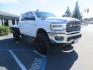 2022 White RAM 2500 Laramie Crew Cab SWB 4WD (3C6UR5FL5NG) with an 6.7L L6 OHV 24V TURBO DIESEL engine, 6A transmission, located at 2630 Grass Valley Highway, Auburn, CA, 95603, (530) 508-5100, 38.937893, -121.095482 - Custom Flat bed with emergency flashers and LED back up lights, Carli Suspension, 20" Fuel Rebel wheels, Fuel Gripper tires, Westin Running Boards, Air Bags, and window tint. - Photo#2