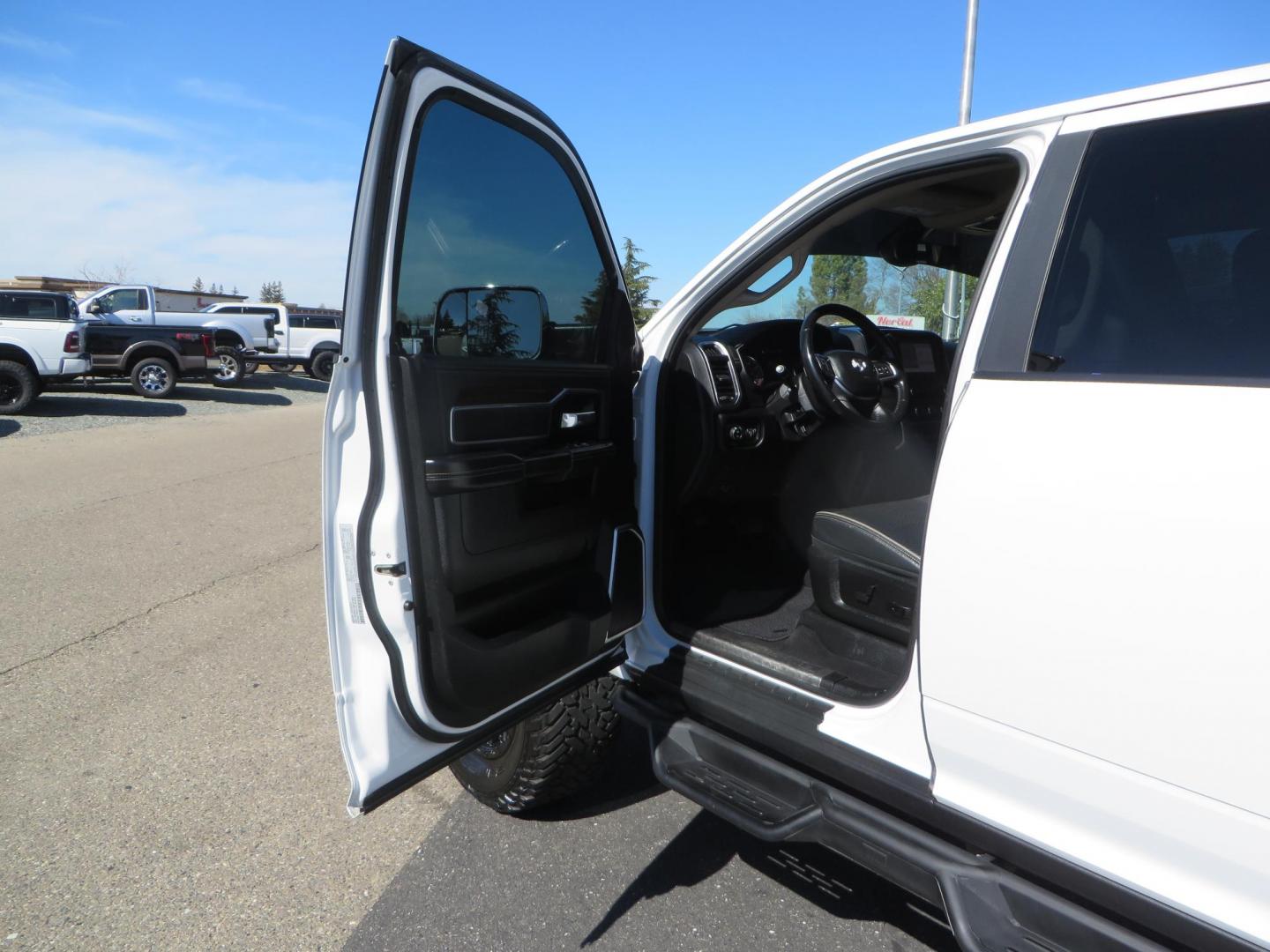 2022 White RAM 2500 Laramie Crew Cab SWB 4WD (3C6UR5FL5NG) with an 6.7L L6 OHV 24V TURBO DIESEL engine, 6A transmission, located at 2630 Grass Valley Highway, Auburn, CA, 95603, (530) 508-5100, 38.937893, -121.095482 - Custom Flat bed with emergency flashers and LED back up lights, Carli Suspension, 20" Fuel Rebel wheels, Fuel Gripper tires, Westin Running Boards, Air Bags, and window tint. - Photo#15