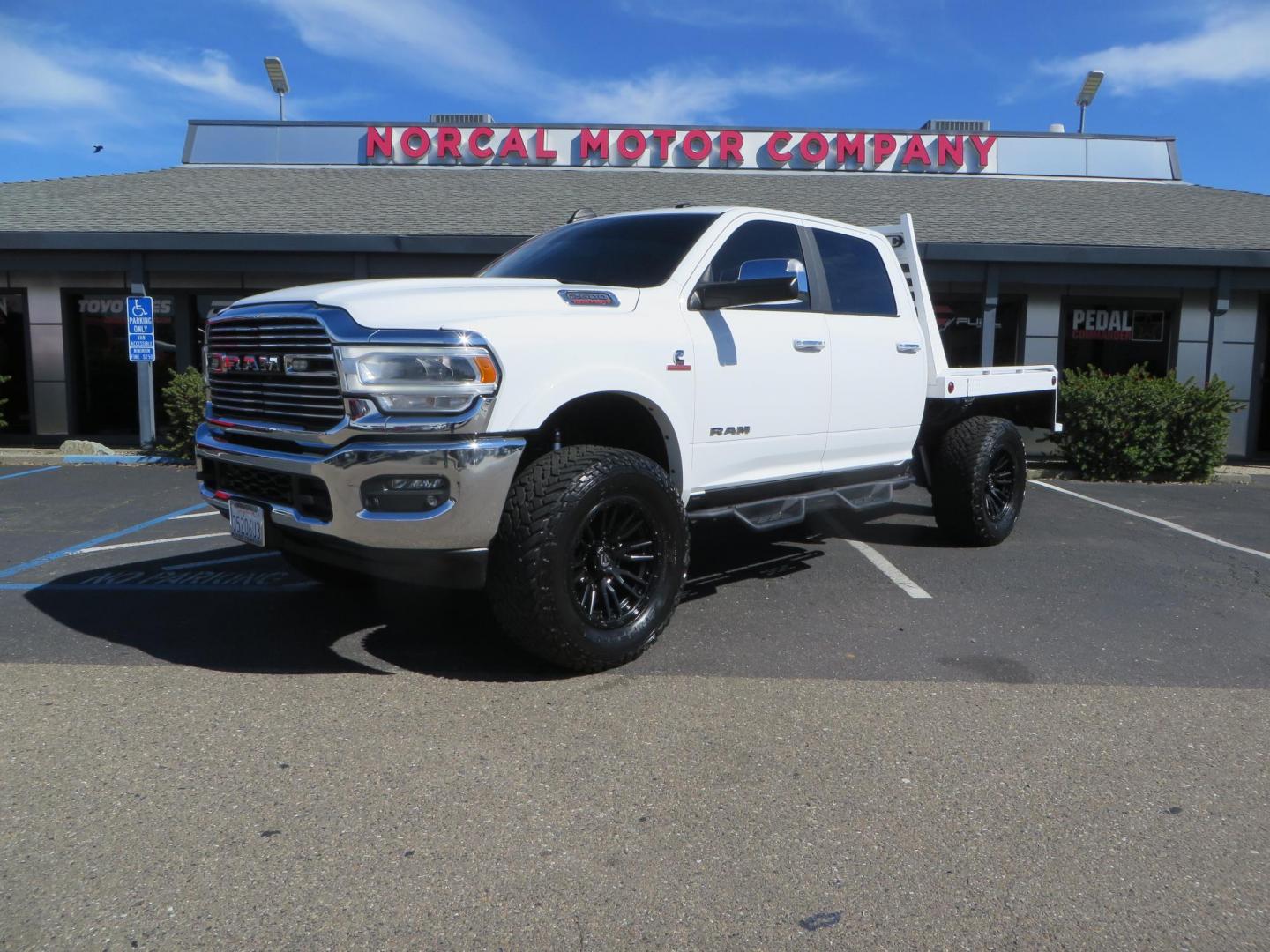 2022 White RAM 2500 Laramie Crew Cab SWB 4WD (3C6UR5FL5NG) with an 6.7L L6 OHV 24V TURBO DIESEL engine, 6A transmission, located at 2630 Grass Valley Highway, Auburn, CA, 95603, (530) 508-5100, 38.937893, -121.095482 - Custom Flat bed with emergency flashers and LED back up lights, Carli Suspension, 20" Fuel Rebel wheels, Fuel Gripper tires, Westin Running Boards, Air Bags, and window tint. - Photo#0