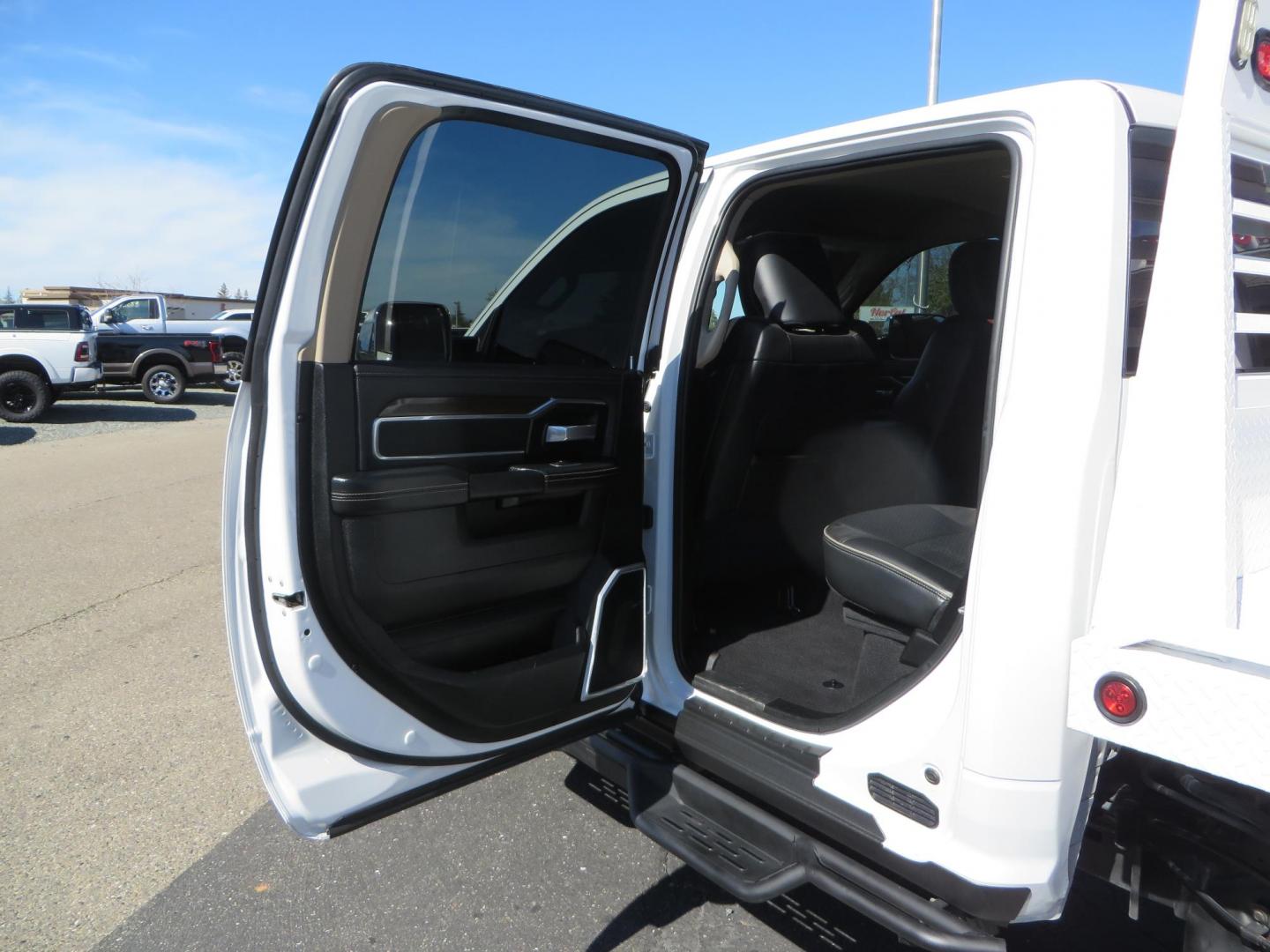 2022 White RAM 2500 Laramie Crew Cab SWB 4WD (3C6UR5FL5NG) with an 6.7L L6 OHV 24V TURBO DIESEL engine, 6A transmission, located at 2630 Grass Valley Highway, Auburn, CA, 95603, (530) 508-5100, 38.937893, -121.095482 - Custom Flat bed with emergency flashers and LED back up lights, Carli Suspension, 20" Fuel Rebel wheels, Fuel Gripper tires, Westin Running Boards, Air Bags, and window tint. - Photo#45