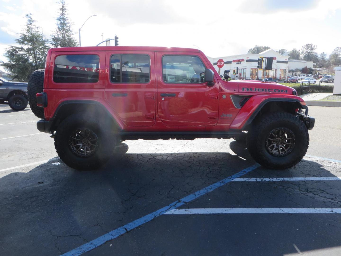 2024 Red /Black Jeep Wrangler Rubicon 392 (1C4RJXSJ3RW) with an 6.4L V8 DOHC 32V engine, 6M transmission, located at 2630 Grass Valley Highway, Auburn, CA, 95603, (530) 508-5100, 38.937893, -121.095482 - Final Edition Rubicon 392 with every option... Sitting on 17" Bronze Fuel Rebel wheels, 37" Toyo RT Trail tires, Baja Designs LP4 A pillar and bumper lights, paint correction before fully ceramic coated, PPF, and Ceramic window tint on front door glass and windshield. Sky One Touch Power top, Remova - Photo#3