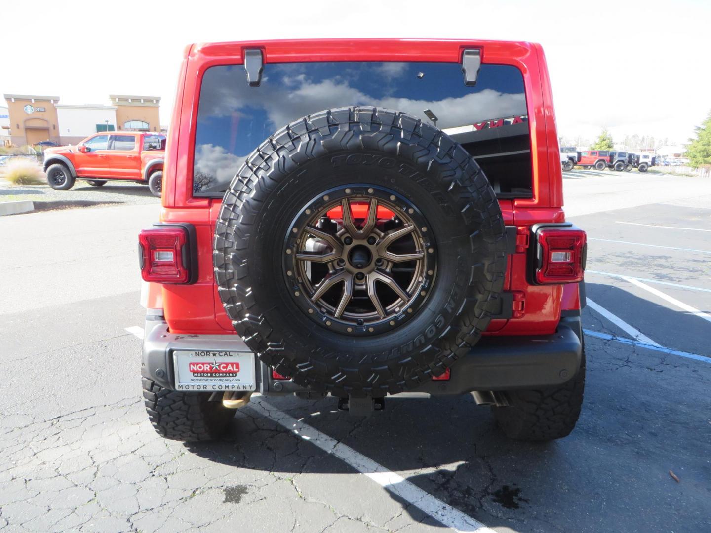 2024 Red /Black Jeep Wrangler Rubicon 392 (1C4RJXSJ3RW) with an 6.4L V8 DOHC 32V engine, 6M transmission, located at 2630 Grass Valley Highway, Auburn, CA, 95603, (530) 508-5100, 38.937893, -121.095482 - Final Edition Rubicon 392 with every option... Sitting on 17" Bronze Fuel Rebel wheels, 37" Toyo RT Trail tires, Baja Designs LP4 A pillar and bumper lights, paint correction before fully ceramic coated, PPF, and Ceramic window tint on front door glass and windshield. Sky One Touch Power top, Remova - Photo#4