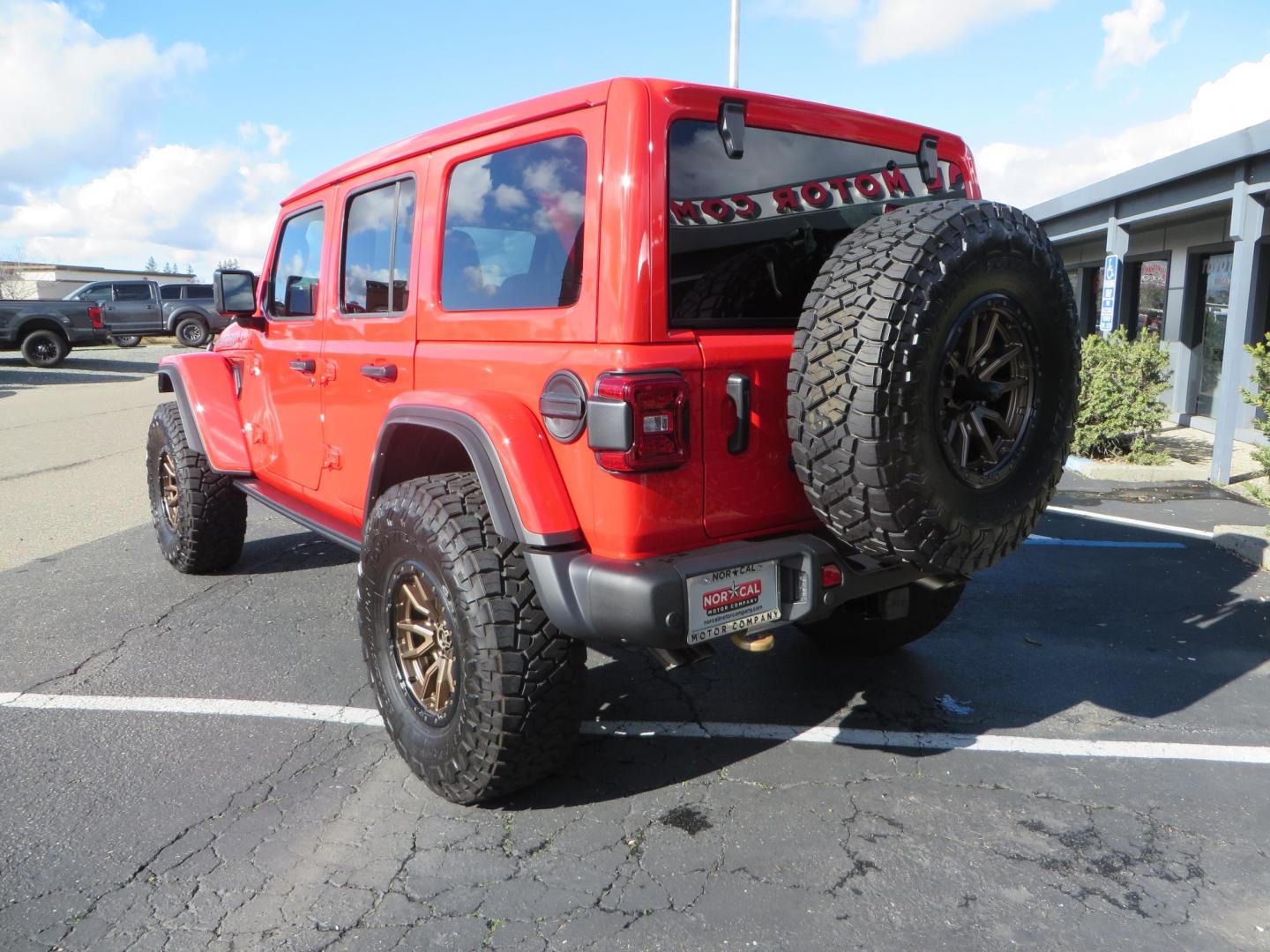 2024 Red /Black Jeep Wrangler Rubicon 392 (1C4RJXSJ3RW) with an 6.4L V8 DOHC 32V engine, 6M transmission, located at 2630 Grass Valley Highway, Auburn, CA, 95603, (530) 508-5100, 38.937893, -121.095482 - Final Edition Rubicon 392 with every option... Sitting on 17" Bronze Fuel Rebel wheels, 37" Toyo RT Trail tires, Baja Designs LP4 A pillar and bumper lights, paint correction before fully ceramic coated, PPF, and Ceramic window tint on front door glass and windshield. Sky One Touch Power top, Remova - Photo#6